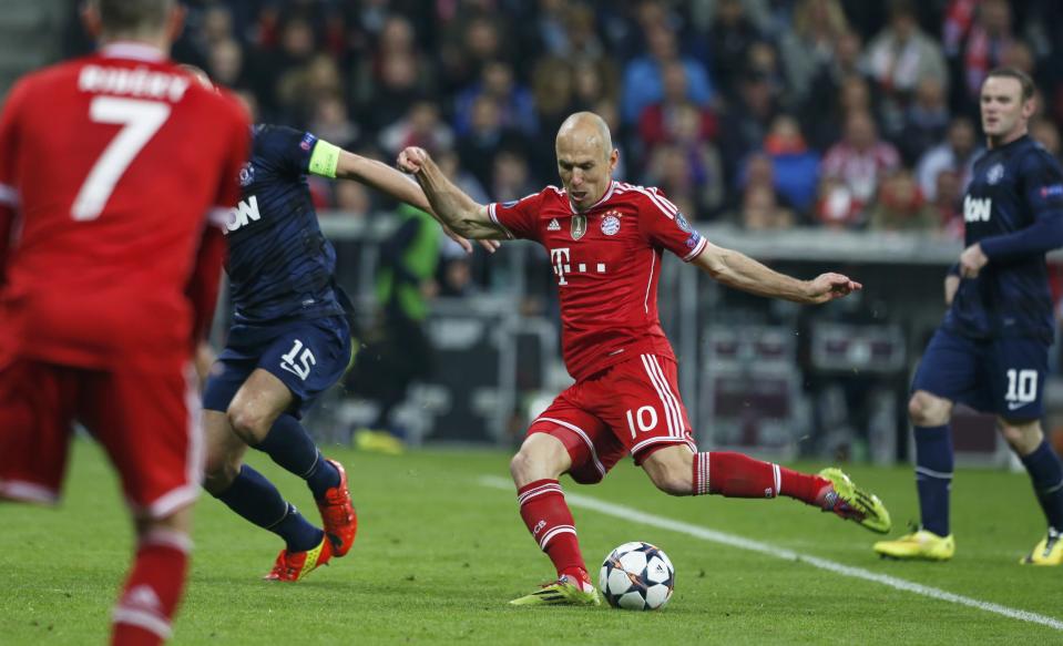 Bayern Munich's Robben scores a goal past Manchester United's Vidic during their Champions League quarter-final second leg soccer match in Munich