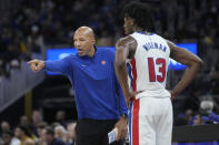 Detroit Pistons coach Monty Williams, left, gestures while talking to center James Wiseman during the second half of the team's NBA basketball game against the Golden State Warriors in San Francisco, Friday, Jan. 5, 2024. (AP Photo/Jeff Chiu)
