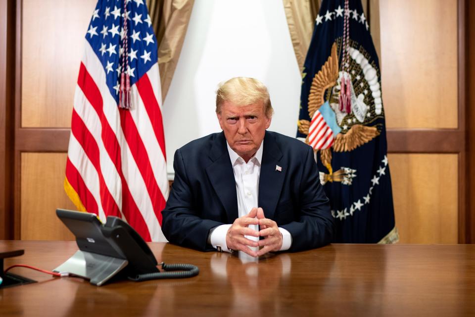 BETHESDA, MD - OCTOBER 04: In this handout provided by The White House, President Donald Trump participates in a phone call with Vice President Mike Pence, Secretary of State Mike Pompeo, and Chairman of the Joint Chiefs of Staff Gen. Mark Milley in his conference room at Walter Reed National Military Medical Center on October 4, 2020 in Bethesda, Maryland. Chief of Staff Mark Meadows (not pictured) is also present in the room on the call. (Photo by Tia Dufour/The White House via Getty Images)