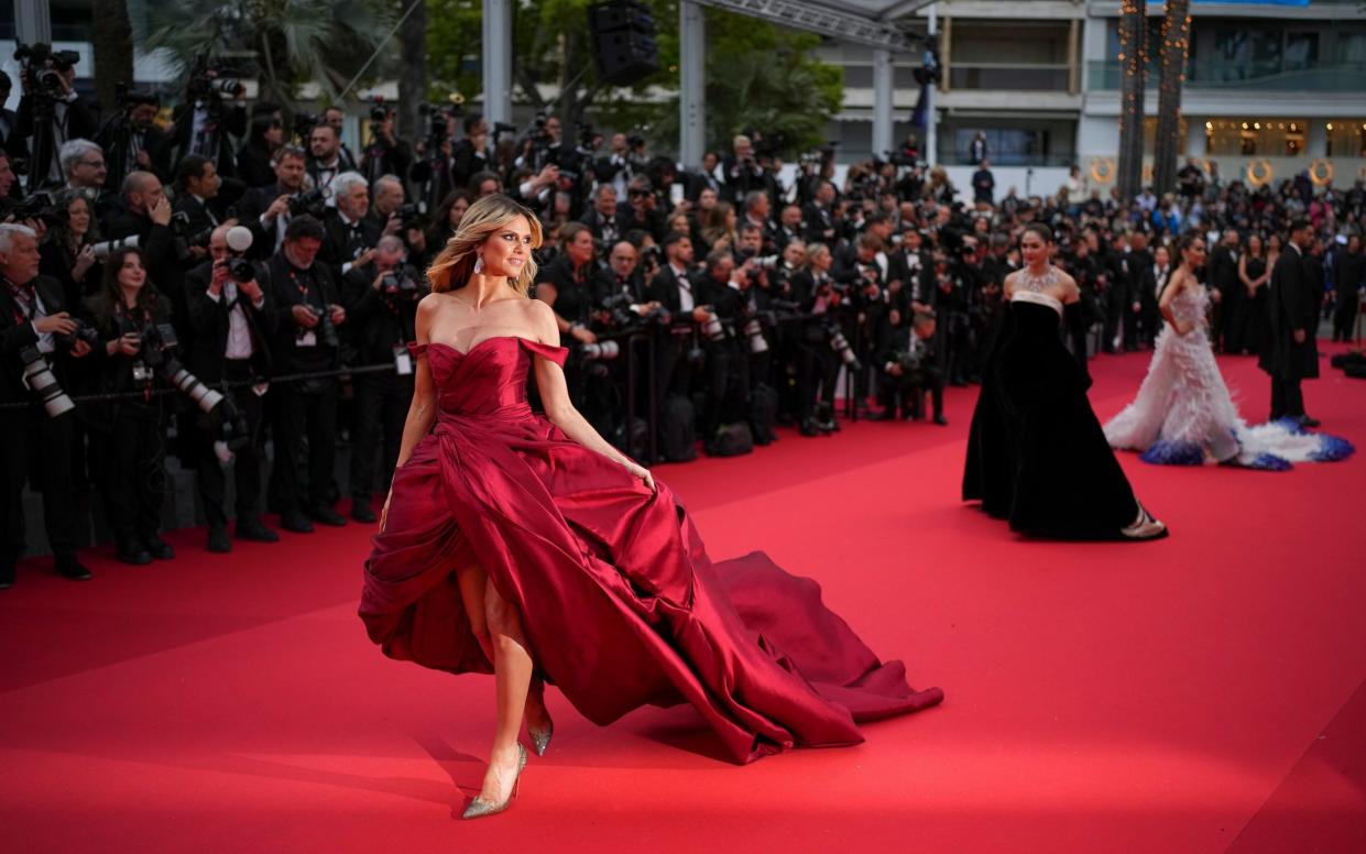 Heidi Klum poses for photographers upon arrival at the awards ceremony and the premiere of the film 'The Second Act'