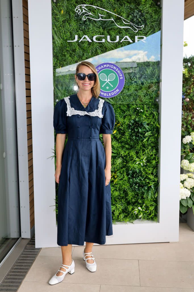 <p>Anna Maxwell Martin wore a navy midi dress with a lace collar and multi-strap sandals.</p>