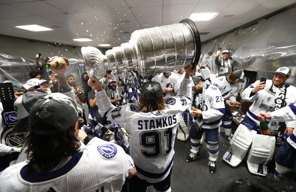 EDMONTON, ALBERTA - SEPTEMBER 28: Steven Stamkos #91 of the Tampa Bay Lightning hoists the Stanley Cup overhead in the locker room after the Tampa Bay Lightning defeated the Dallas Stars 2-0 in Game Six of the NHL Stanley Cup Final to win the best of seven game series 4-2 at Rogers Place on September 28, 2020 in Edmonton, Alberta, Canada. (Photo by Dave Sandford/NHLI via Getty Images)