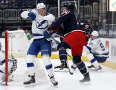 Tampa Bay Lightning forward Ross Colton, left, gets crossed up with Columbus Blue Jackets forward Zac Dalpe during the second period of an NHL hockey game in Columbus, Ohio, Thursday, April 8, 2021. (AP Photo/Paul Vernon)