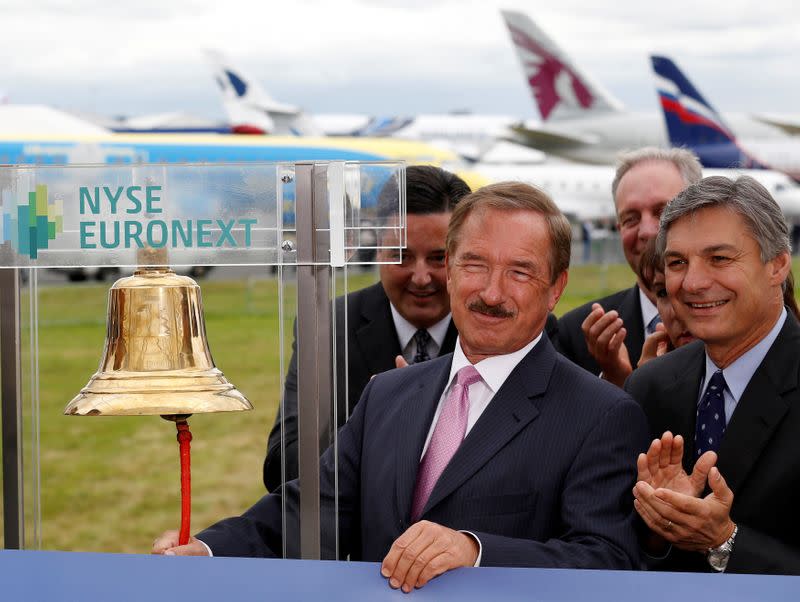 FILE PHOTO: CEO of Air Lease Corp. Steven Udvar-Hazy rings the New York Stock Exchange bell alongside CEO of Boeing Commercial Airplanes Ray Conner at the Farnborough Airshow 2012 in southern England