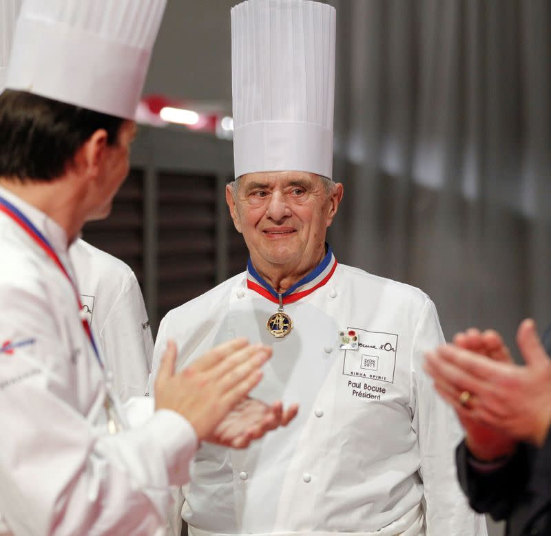 FILE PHOTO: French chef Bocuse is applauded during the Bocuse d'Or cooking contest ceremony