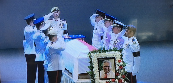 The Coffin Bearer Party salutes Nathan at the state funeral service at the UCC. (Photo: TV screenshot)