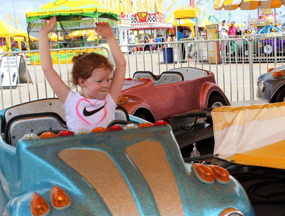 Hopefully, 4-year-old Kaiyah Willett's mom keeps both hands on the steering wheel. Perhaps she noticed the other cars were staying on the road without drivers at the fair in 2020.