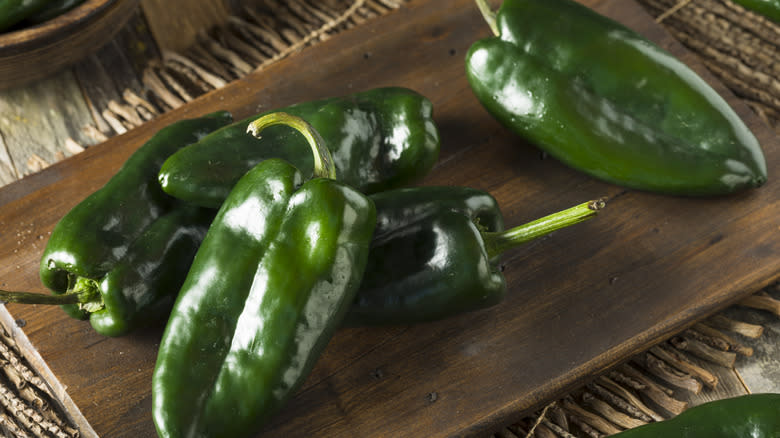 poblano peppers on cutting board