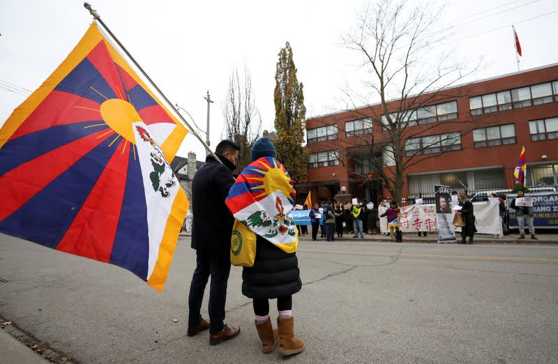 People protest in solidarity over COVID-19 restrictions in mainland China, in Toronto