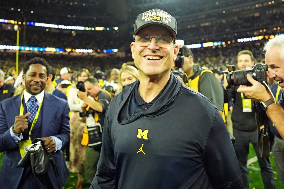 Michigan Wolverines head coach Jim Harbaugh celebrates after beating the Washington Huskies in the 2024 College Football Playoff national championship game at NRG Stadium.