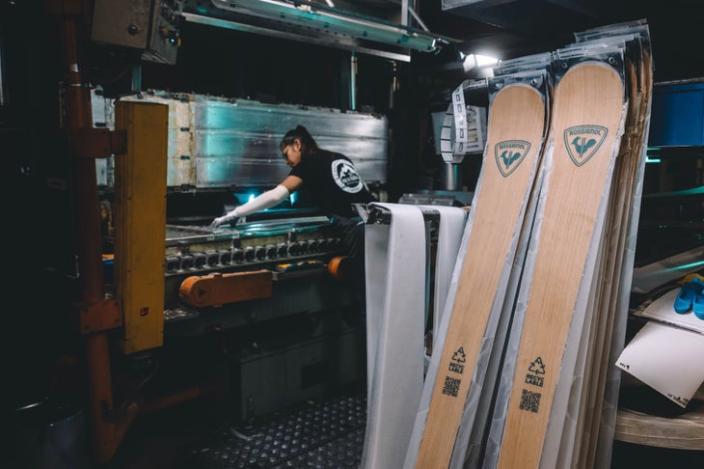 Workers making skis in a factory