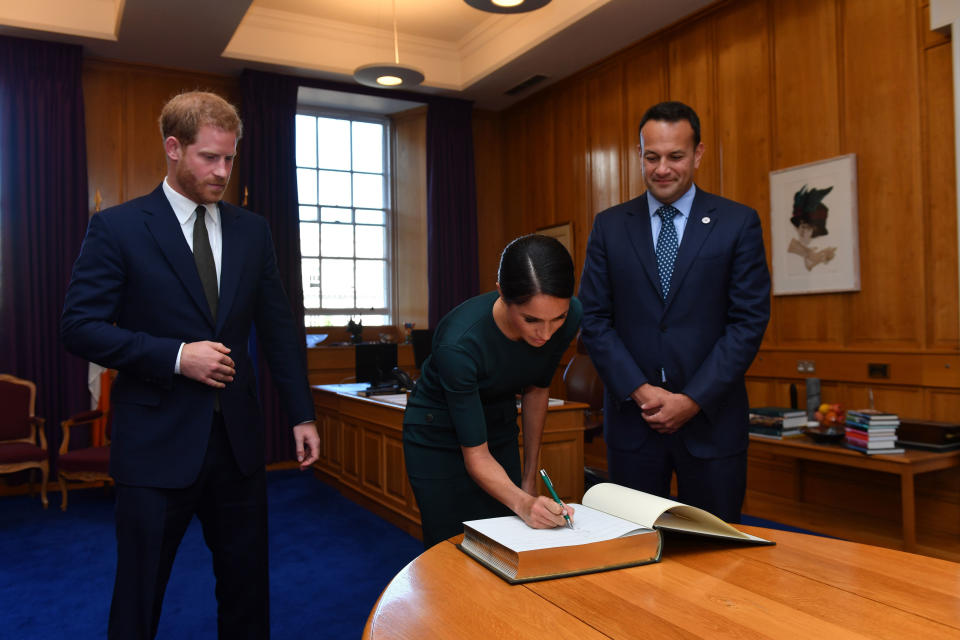 The Duke and Duchess of Sussex signed the visitor book at Government Buildings alongside Taoiseach, Leo Varadkar [Photo: PA]