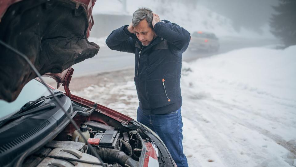 Car breakdown on the road in winter conditions.