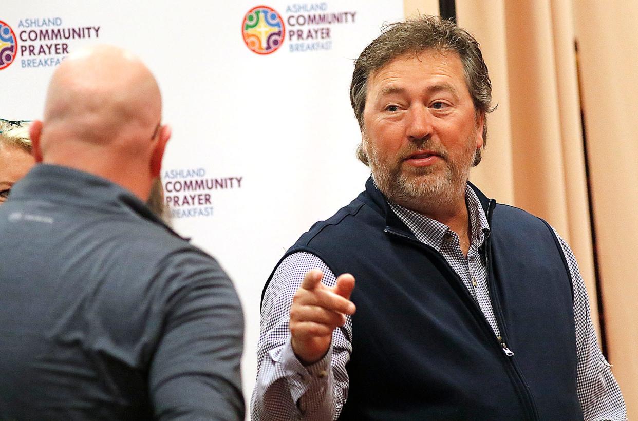 Duck Dynasty's Alan Robertson talks with attendees prior to the start of the Ashland County Ministerial Association's Ashland Community Prayer breakfast to celebrate National Day of Prayer on Thursday, May 5, 2022 at Ashland University's John C. Myers Convocation Center. TOM E. PUSKAR/TIMES-GAZETTE.COM