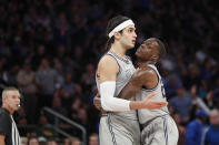 Georgetown forward Josh LeBlanc (23) restrains center Omer Yurtseven (44) after Yurtseven was called for a foul and objected to the call during the second half of the team's NCAA college basketball game against Duke in the 2K Empire Classic, Friday, Nov. 22, 2019 in New York. Duke won 81-73. (AP Photo/Kathy Willens)