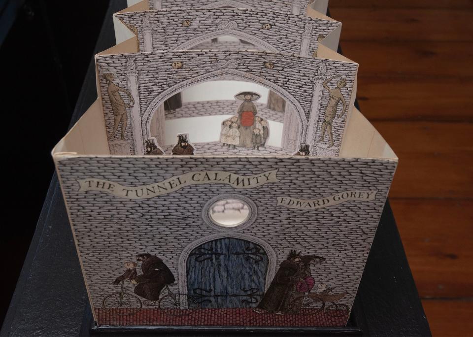 A tunnel book created by Edward Gorey complete with a viewing lens is on display as part of a new exhibit on moveable books at the Edward Gorey House in Yarmouth Port.
