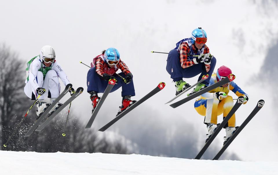 France's Ophelie David, Canada's Kelsey Serwa, Canada's Marielle Thompson and Sweden's Anna Holmlund (L-R) compete during the women's freestyle skiing skicross finals at the 2014 Sochi Winter Olympic Games in Rosa Khutor, February 21, 2014. REUTERS/Mike Blake (RUSSIA - Tags: SPORT OLYMPICS SKIING)