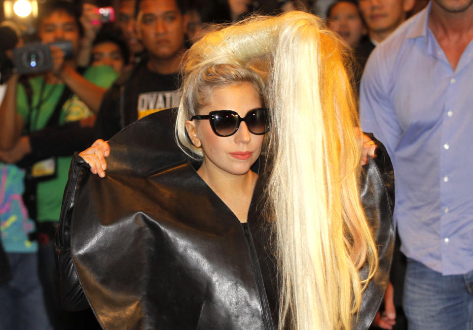 FILE - In this May 19, 2012 file photo, American pop singer Lady Gaga poses before the media upon her arrival in a hotel in Manila's financial district of Makati, Philippines. Lady Gaga is as confused as anyone about whether she'll be allowed to perform in Indonesia following her performances in the Philippines. Police initially denied a permit for the "Born This Way Ball" but are now hinting the concert could ahead if the pop diva toned down the show. (AP Photo/Pat Roque, File)
