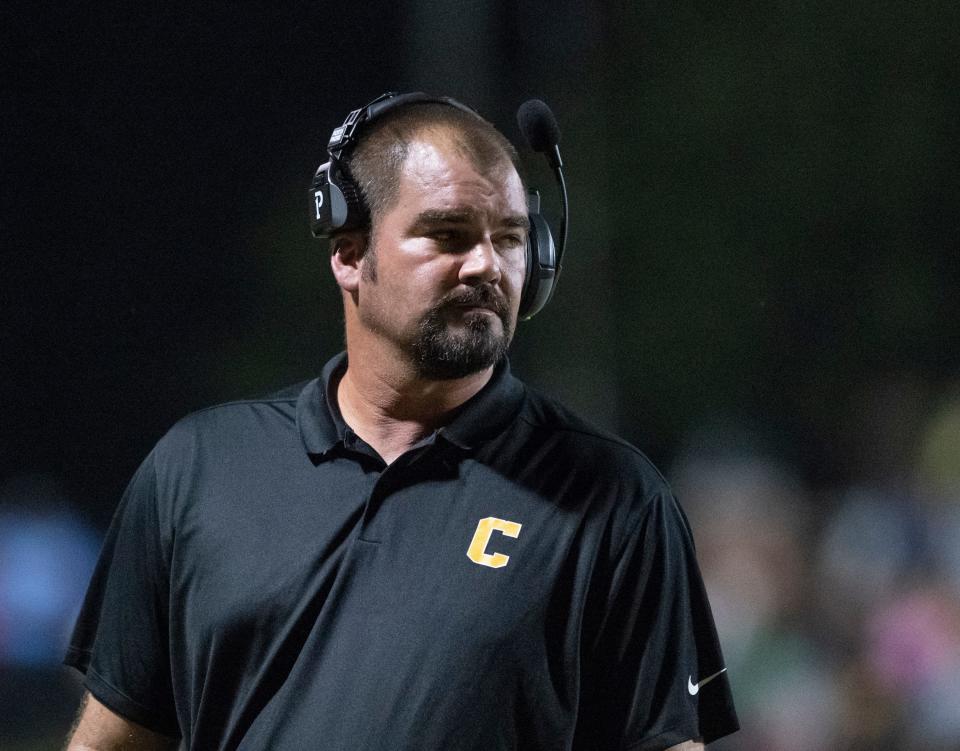 Crusaders head coach Matt Adams keeps an eye on the field during the Tate vs Catholic varsity Kickoff Classic football game at Pensacola Catholic High School in Pensacola on Friday, Aug. 19, 2022.