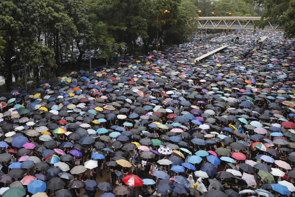 Protesters gather in Hong Kong Sunday, Aug. 18, 2019. Thousands of people streamed into a park in central Hong Kong for what organizers hope will be a peaceful demonstration for democracy in the semi-autonomous Chinese territory. (AP Photo/Kin Cheung)