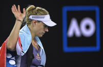 Germany's Angelique Kerber waves as she leaves the court following her fourth round loss to Russia's Anastasia Pavlyuchenkova at the Australian Open tennis championship in Melbourne, Australia, Monday, Jan. 27, 2020. (AP Photo/Andy Brownbill)