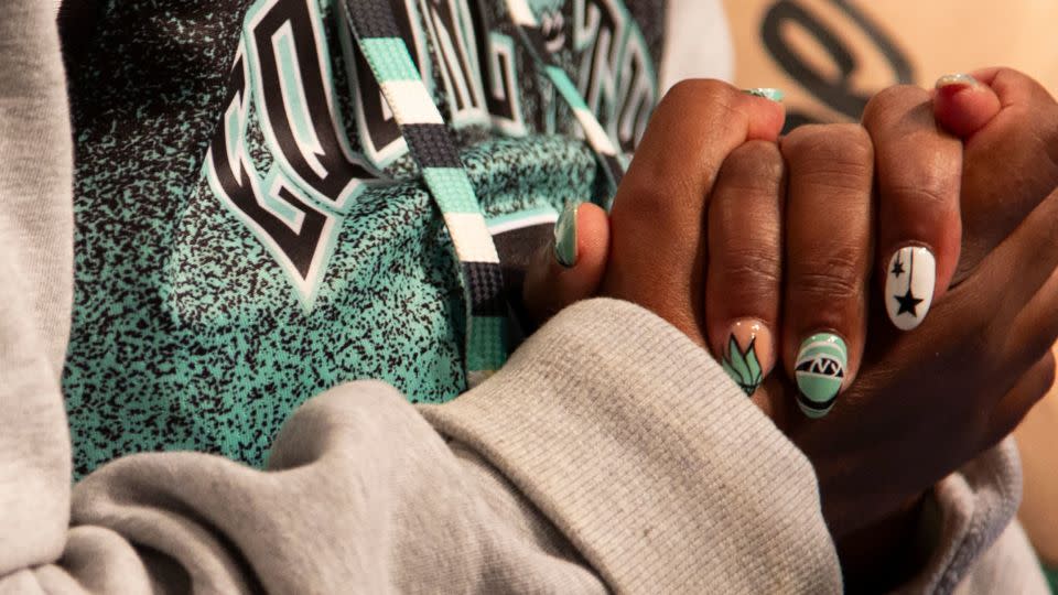 Season ticket holder Arvetta Drumgold had her nails done to match the Liberty's colors. - Laura Oliverio/CNN