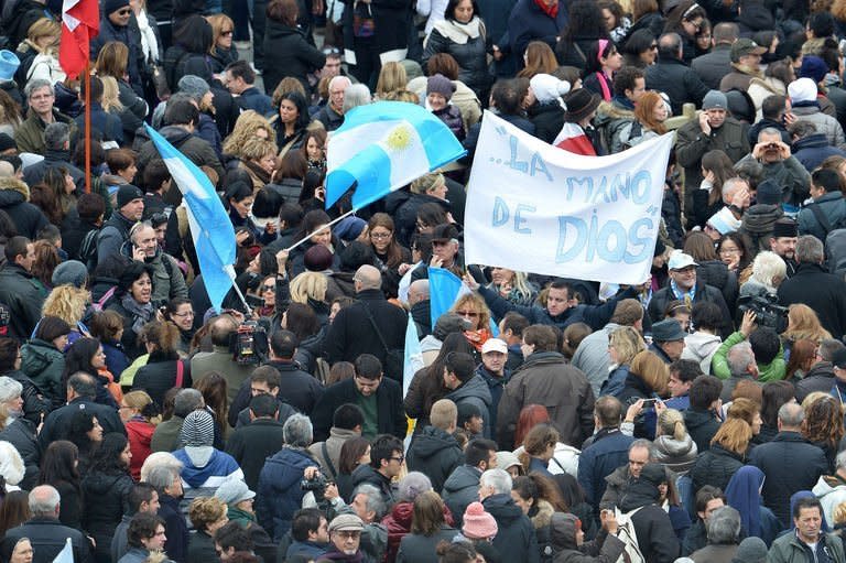 People wait for pope's first Angelus prayer at St Peter's Square on March 17, 2013