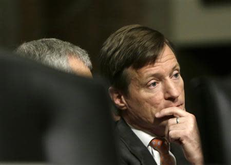 Credit Suisse CEO Brady Dougan awaits to testify before the Senate Homeland and Governmental Affairs Investigations Subcommittee on Capitol Hill in Washington February 26, 2014. REUTERS/Gary Cameron