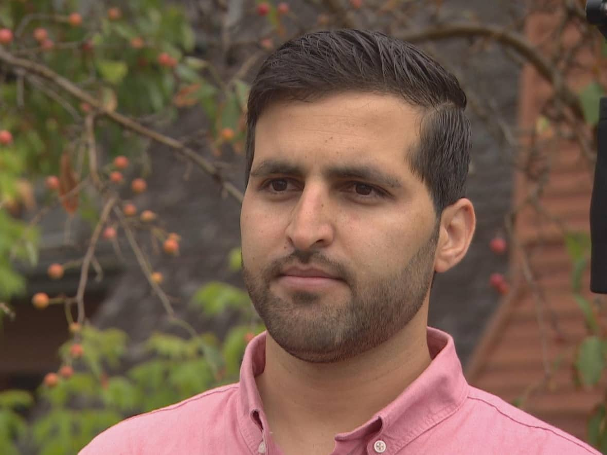 Nearly a year after he set foot in Canada, Mohammad Fahim Rahmani's support through the federal Resettlement Assistance Program is coming to an end — even as his parents' papers languish in the processing queue with the federal government. Now he's being told to leave for a shelter and sign up for social assistance.  (Darek Zdzienicki/CBC - image credit)