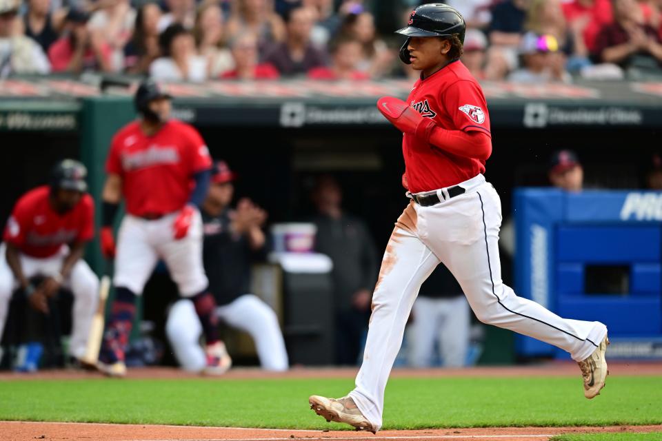 Cleveland Guardians' Bo Naylor scores a run on an RBI single by Amed Rosario during the third inning Wednesday against the Oakland Athletics in Cleveland.