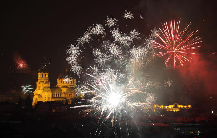 Fireworks explode over the Alexander Nevski cathedral. (Photo: Stoyan Nenov/Reuters)