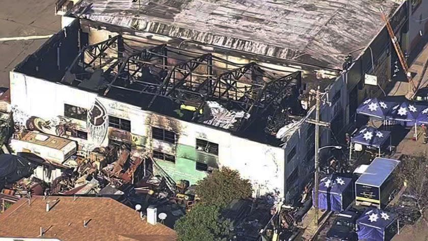 FILE - This Dec. 3, 2016 file image from video provided by KGO-TV shows the Ghost Ship Warehouse after a fire swept through the Oakland, Calif., building. A Northern California district attorney has told a judge she will no longer consider plea deals for two men charged in a 2016 warehouse fire that killed 36 people attending an unlicensed concert. The Associated Press obtained a copy of the letter Thursday, Aug. 16, 2018, a day before the two men are scheduled to return to court. (KGO-TV via AP, File)