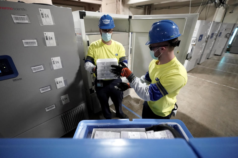 Boxes containing the Pfizer-BioNTech COVID-19 vaccine are prepared to be shipped at the Pfizer Global Supply Kalamazoo manufacturing plant in Portage, Mich., Sunday, Dec. 13, 2020. (AP Photo/Morry Gash, Pool)