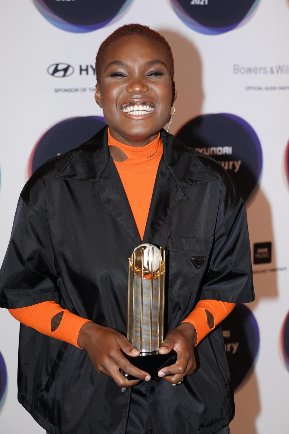 Nominated artist Arlo Parks holding the shortlist trophy during the announcement of the shortlist for the Hyundai Mercury Prize Albums of the Year, at the Langham Hotel in London. Picture date: Thursday July 22, 2021.