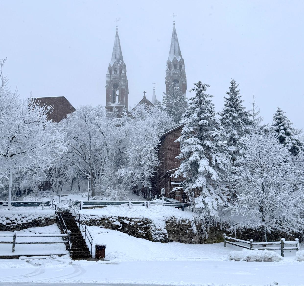 Snow covers the trees around the Basilica and National Shrine of Mary Help of Christians at Holy Hill in Hubertus on Tuesday, Jan. 9, 2024. A winter storm warning is in effect all Tuesday through Wednesday morning for much of the state.
