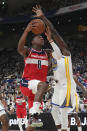 Washington Wizards' Rui Hachimura, left, shoots over Golden State Warriors' Draymond Green during the preseason NBA basketball game, Friday, Sept. 30, 2022, at Saitama Super Arena, in Saitama, north of Tokyo. (AP Photo/Eugene Hoshiko)