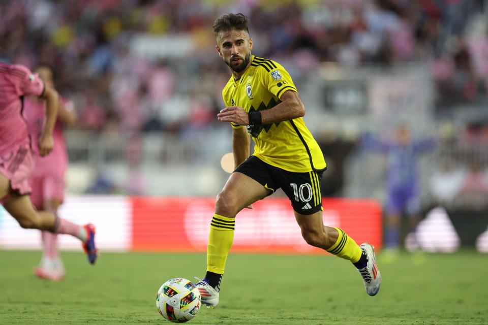 Jun 19, 2024; Fort Lauderdale, Florida, USA; Columbus Crew forward Diego Rossi (10) kicks the ball against Inter Miami CF during the first half at Chase Stadium. Mandatory Credit: Nathan Ray Seebeck-USA TODAY Sports