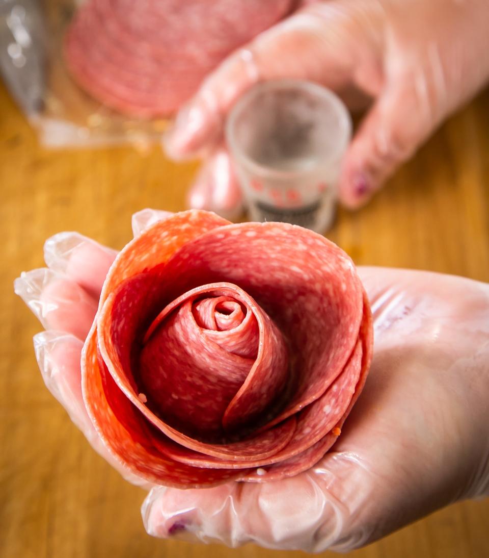 Serena Shumate shows a rose salami that she learned to make on YouTube. She started making charcuterie boards for family and friends and now has made it into a business called The Charcuterie Mama. She creates other boards like breakfast and candy trays for holidays, events and special occasions.