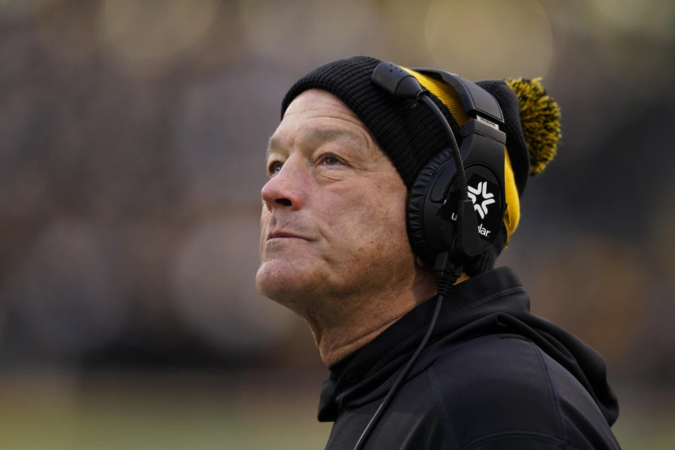 Iowa head coach Kirk Ferentz watches from the bench during the first half of an NCAA college football game against Minnesota, Saturday, Nov. 13, 2021, in Iowa City, Iowa. (AP Photo/Charlie Neibergall)