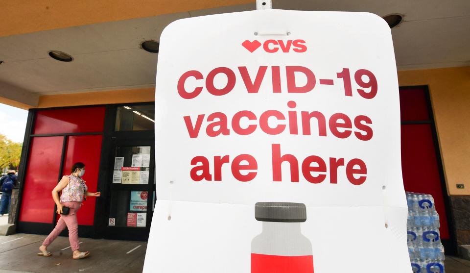 A woman enters a CVS Covid-19 vaccine site in Monterey Park, California on April 27, 2021 - Los Angeles County health officials are concerned about thousands of residents not getting their 2nd dose of the Covid-19 vaccine as the Center for Disease Control also reports on troubling nationwide statistics showing more than 5 million Americans have not followed up with their second dose of the Moderna of Pfizer vaccines. (Photo by Frederic J. BROWN / AFP) (Photo by FREDERIC J. BROWN/AFP via Getty Images)