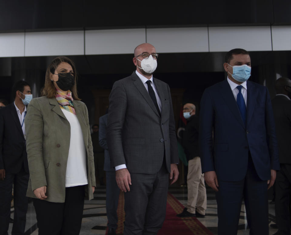 Najla Al-Manqoush, the Minister of Foreign Affairs, together with Mr. Charles Michel, the President of the European Council and the Prime Minister of the Government of National Unity, Abdul Hamid Dbeibeh, pose for a press photo at the entrance of the Prime Minister's office on Sunday, April 4, 2021, in Tripoli, Libya. (AP Photo/Nada Harib)