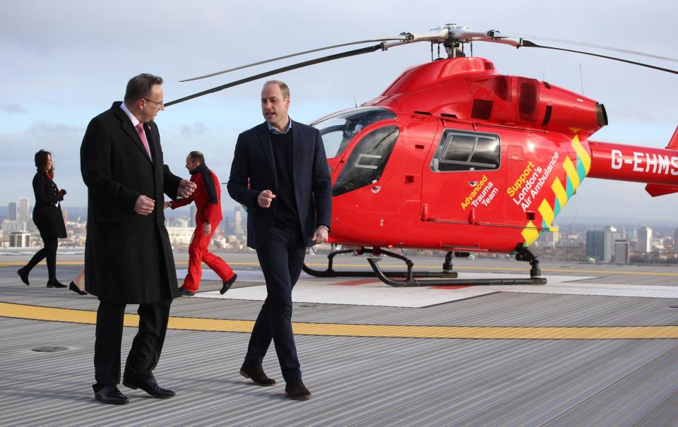 Britain's Prince William, Duke of Cambridge (R), walks across the helipad after arriving in a red London Air Ambulance at the Royal London Hospital in east London on January 9, 2019. - The Duke of Cambridge visited London's Air Ambulance to recognise the work that the organisation's first responders carry out delivering life-saving treatment across London. (Photo by Ian Vogler / POOL / AFP)        (Photo credit should read IAN VOGLER/AFP via Getty Images)