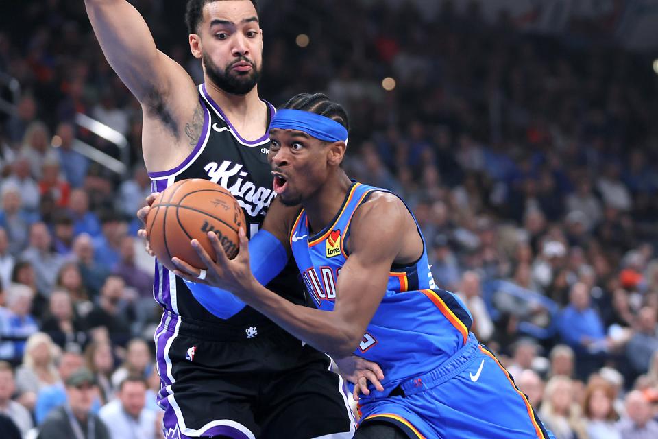 Oklahoma City Thunder guard Shai Gilgeous-Alexander (2) gos past Sacramento Kings forward Trey Lyles (41) during an NBA basketball game between the Oklahoma City Thunder and the Sacramento Kings at Paycom Center in Oklahoma City, Tuesday, April 9, 2024. Oklahoma City won 112-105.