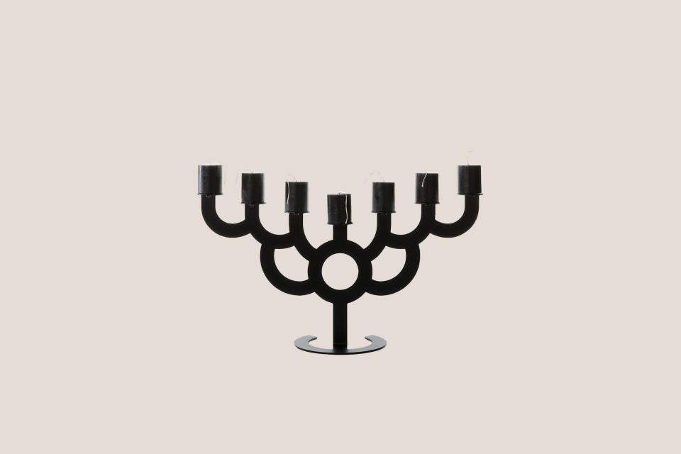 <p>Whoever said a menorah can't make a statement has obviously never seen the Menorah Bold at Moooi. Composed of steel with a powder-coated black finish, this menorah designed by Roderick Vos will instantly liven up any Hanukkah table.</p><p><em>Moooi Menorah Bold, $449, </em><a href="https://shop-us.moooi.com/products/menorah-bold-black-ral-9005" rel="nofollow noopener" target="_blank" data-ylk="slk:shop-us.moooi.com;elm:context_link;itc:0;sec:content-canvas" class="link "><em>shop-us.moooi.com</em></a><em>.</em></p>
