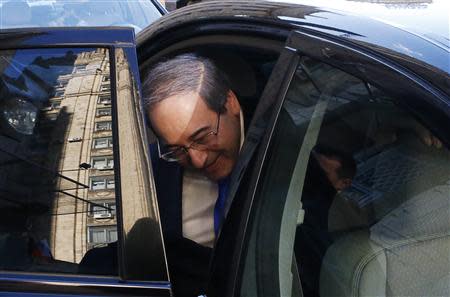 Syria's Deputy Foreign Minister Faisal Mekdad gets into a car after leaving the headquarters of the Russian foreign ministry in Moscow, November 18, 2013. A Syrian government delegation met Russian officials on Monday to discuss plans for an international peace conference on the conflict in the Middle East nation. REUTERS/Grigory Dukor