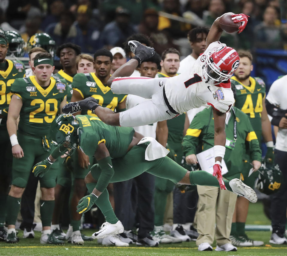 Georgia wide receiver George Pickens makes a catch over Baylor safety Grayland Arnold during the first half of the Sugar Bowl NCAA college football game Wednesday, Jan. 1, 2020, in New Orleans. (Curtis Compton/Atlanta Journal-Constitution via AP)