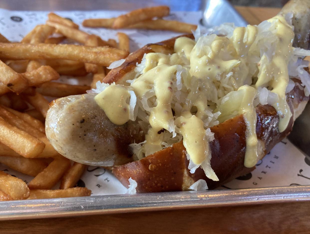 Items like Brussels sprouts and bratwurst sandwiches are available at the happy hour menu at Prost Biergarten in downtown Wilmington.