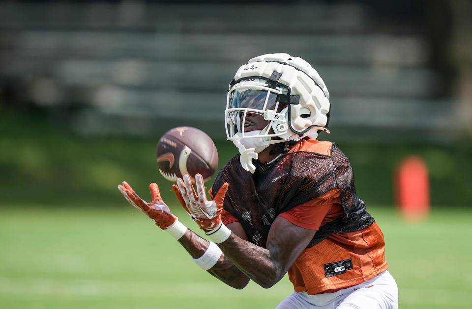 Texas wide receiver Silas Bolden hauls in the ball during a drill at a recent practice at Denius Fields. Bolden, a transfer from Oregon State, has drawn rave reviews from his teammates and coaches since arriving on campus in June.