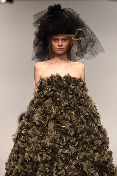 John Rochas presented a heavily textured collection in which models dresses were adorned with materials such as roses.