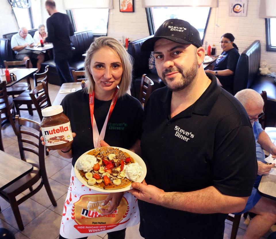 Ledia and Thanas Duka of Steve's Diner in Exeter show off the pancakes that recently won the Nutella Fancake Award. The competition is a fan-voted competition across America. Steve's Diner was one of six independent pancake shop named winners.